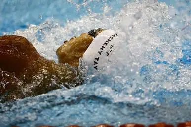A Temasek Polytechnic student competes in a swimming competition, symbolising student ambition and drive. Caption: Zackery Tay has mastered the art of thriving both in class and in the pool with equal determination.
